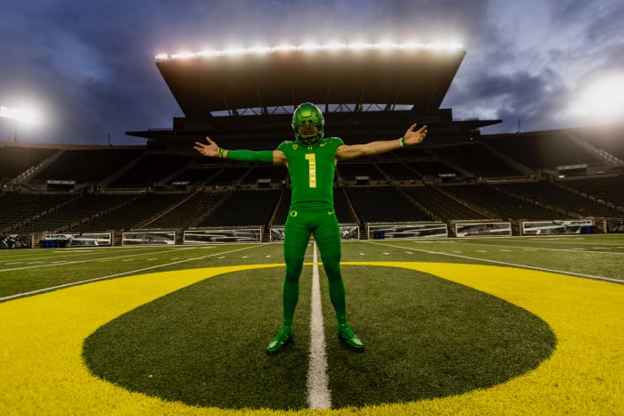 Luke Moga poses at midfield during a photoshoot inside Autzen Stadium.